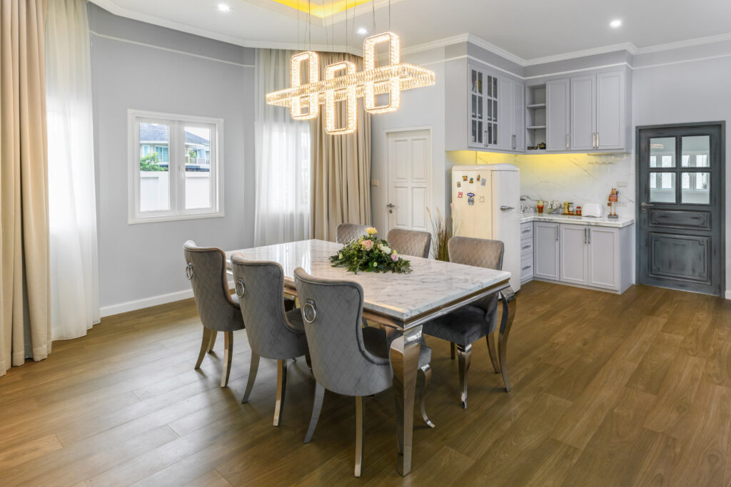 A living room exemplifying home design trends like warm natural wood and statement lighting.