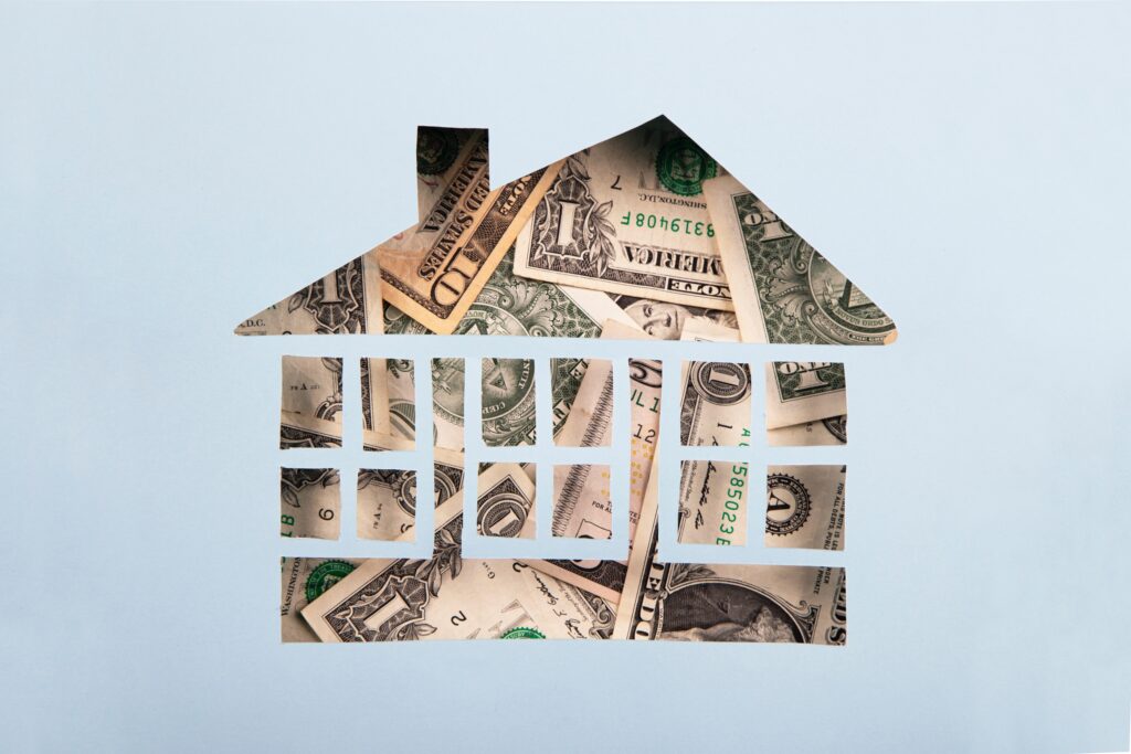 House made of paper and American Dollar Banknotes | © pepifoto / iStock / Getty Images Plus